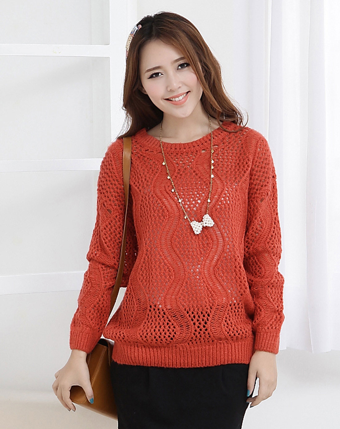 橘色长袖镂空针织衫