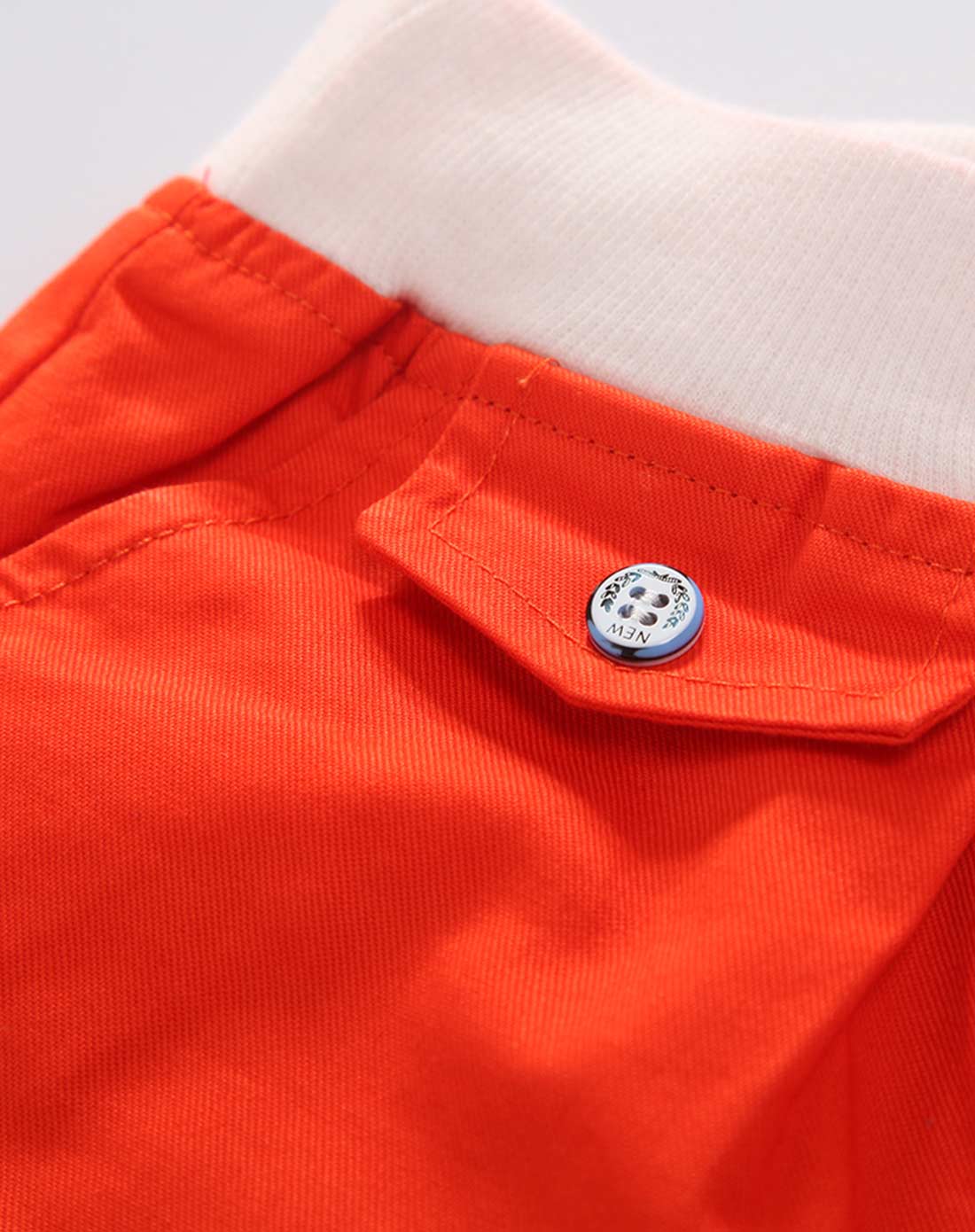 男童橘红拼接休闲中裤