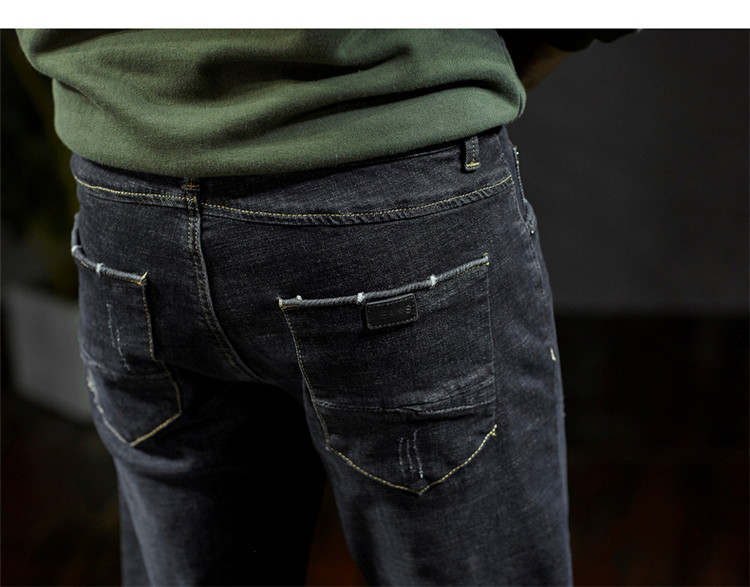 男弹水洗黑色吊磨修身小脚牛仔长裤